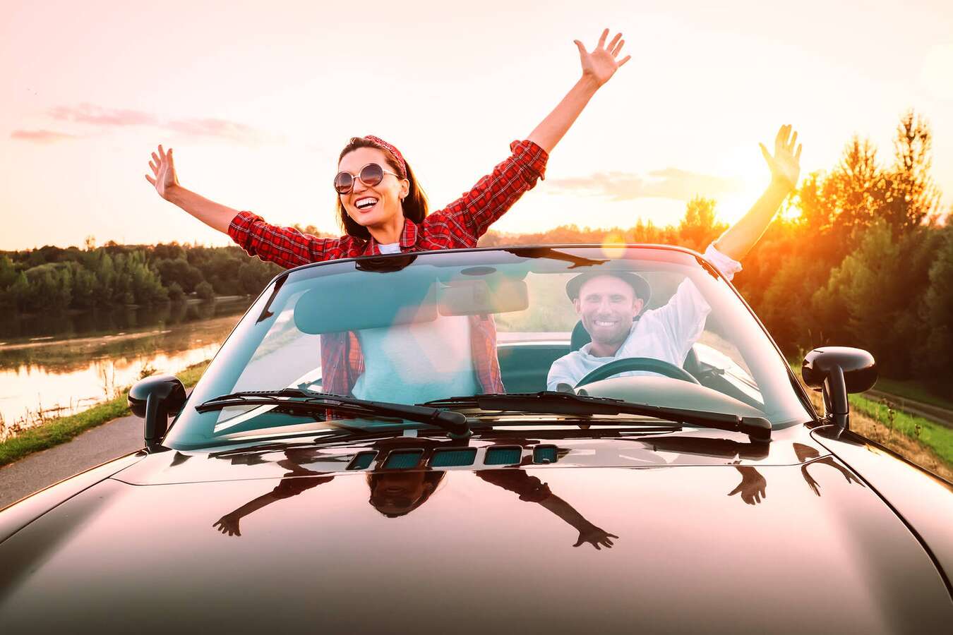 Happy couple enjoying a clean car